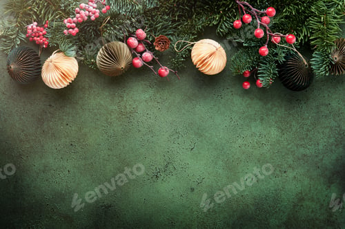 Preview: Christmas composition. Christmas fir tree branches with pine cones and papers rustic balls on old gr
