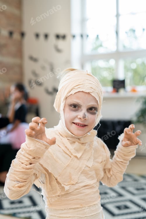 Preview: Little boy in costume of mummy celebrating halloween day