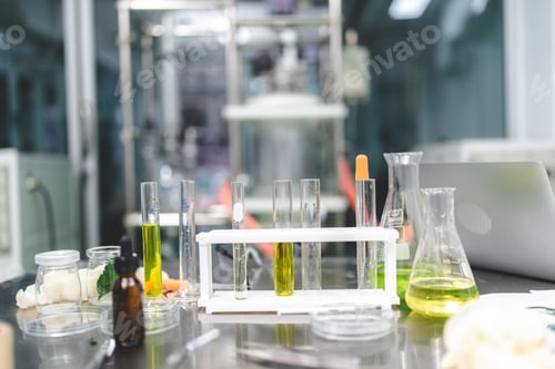 Preview: medical scientist with cannabis hemp research in medicine laboratory to make a herbal extract CBD