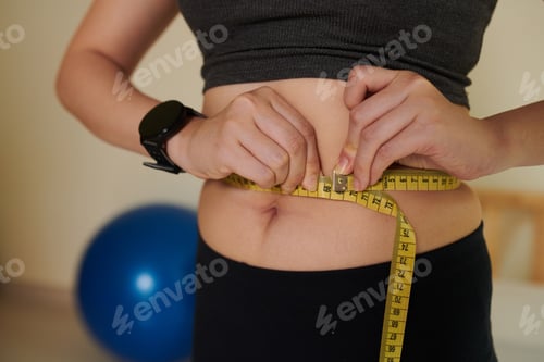 Preview: Woman Measuring Her Waist