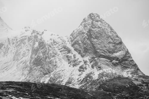Preview: Black and white view of snow capped mountains, Reine, Lofoten, Norway