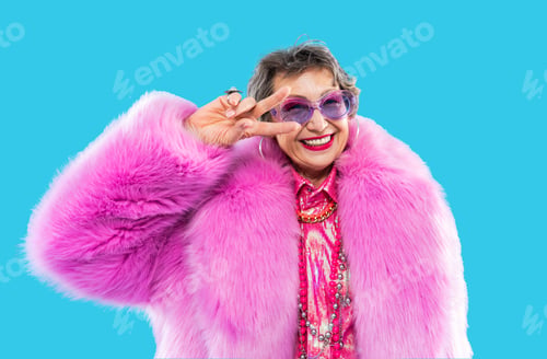 Preview: Happy and funny senior old woman on colorful background