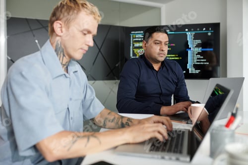 Preview: Project Manager Working on Laptop