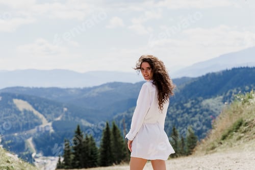 Preview: Girl traveler smiling on green hills. Promo for travel agency. Tourism photography.