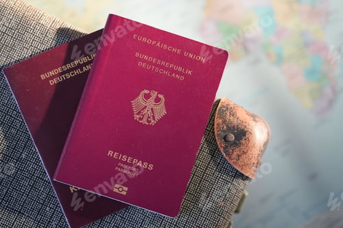 Preview: Closeup of European red passports in German on gray suitcase