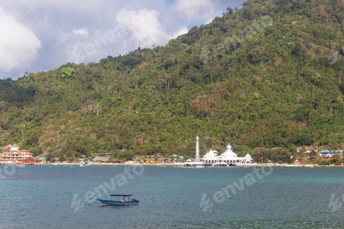 Preview: green tropical island with a mosque on the coast