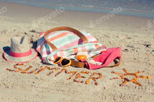 Preview: Inscription summer with shape of sun made of amber stones and accessories for relax or sunbathing