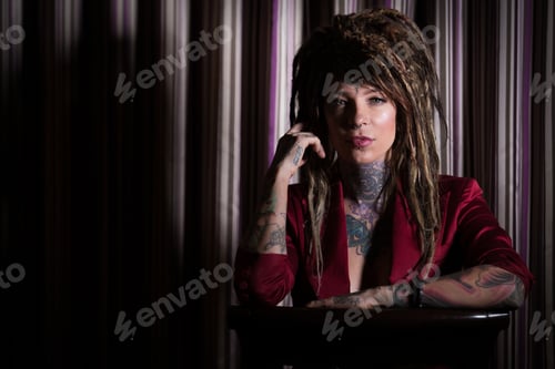 Preview: Beautiful, independent woman with tattoos and dreadlocks