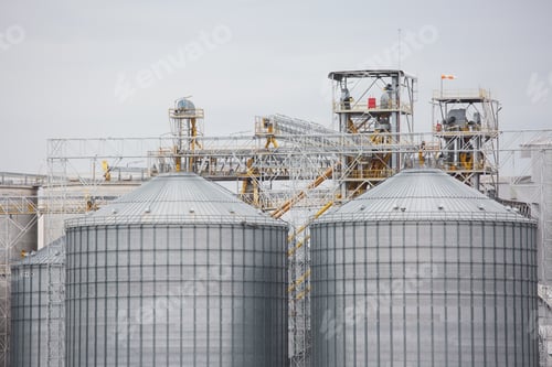 Preview: A modern agricultural grain storage facility with large silos