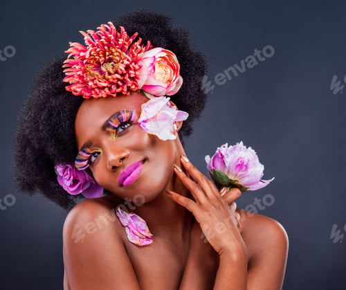 Preview: Studio shot of a beautiful young woman posing with flowers in her hair