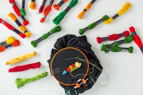 Preview: Background with embroidery. Sewing accessories. Canvas, hoop, thread mouline. Needlework.
