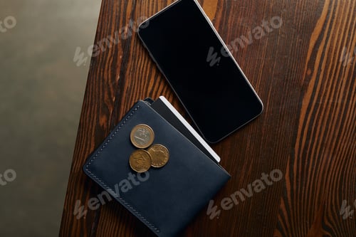 Preview: top view of wallet with credit card, coins and smartphone