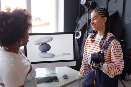 Preview: Smiling Girl Holding Camera During Photoshoot