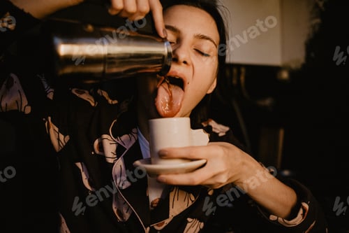 Preview: Coffee addicted woman drinking coffee from jezve.