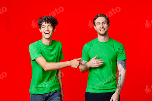Preview: Happy friends in green t-shirts with emotions communication studio
