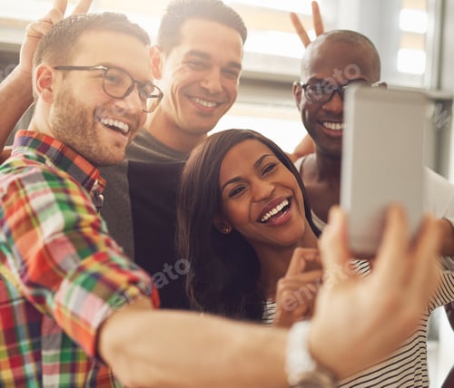 Preview: Laughing co-workers taking self portrait