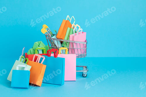 Preview: Shopping basket full of paper bags. Sesonal sale, online deals, discounts, promotions idea