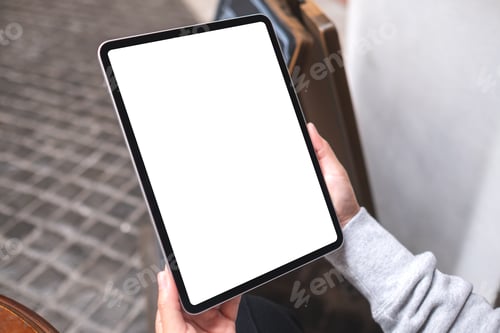 Preview: Mockup image of a woman holding digital tablet with blank white desktop screen in the outdoors
