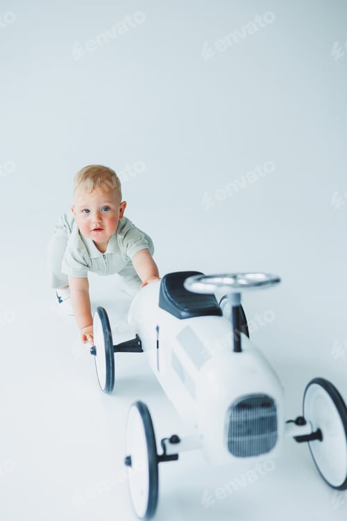 Preview: A little one-year-old boy in a t-shirt runs and laughs around the room. A toddler boy is happy