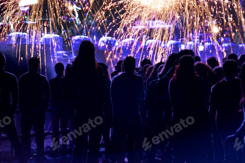 Preview: Crowd and fireworks. New Year concept