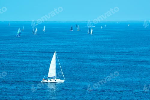 Preview: White yachts sailing at sea
