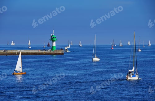 Preview: Beautiful view of boats sailing at the Travemunde Strand beach in Lubeck on a summer day in Germany