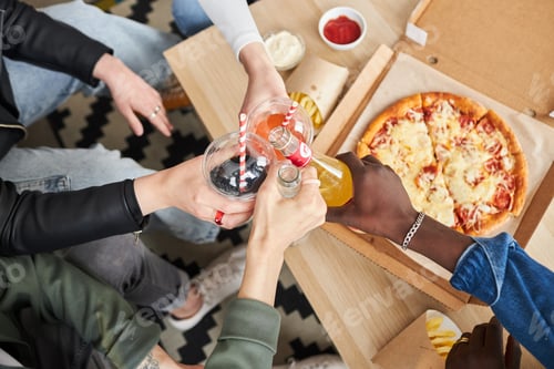 Preview: Friends Toasting Drinks With Pizza and Fries