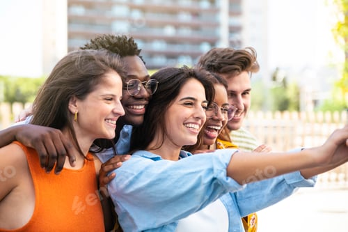Preview: Multiracial group of friends making a selfie with phone in the city - friendship, happiness and