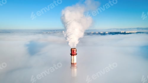 Preview: Aerial view of thermal station's tube visible above the clouds