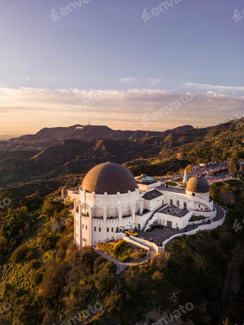Preview: Majestic view of the Griffith Observatory nestled atop a mountain at the golden hour of sunset