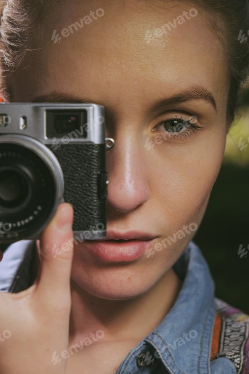 Preview: pretty girl with vintage camera