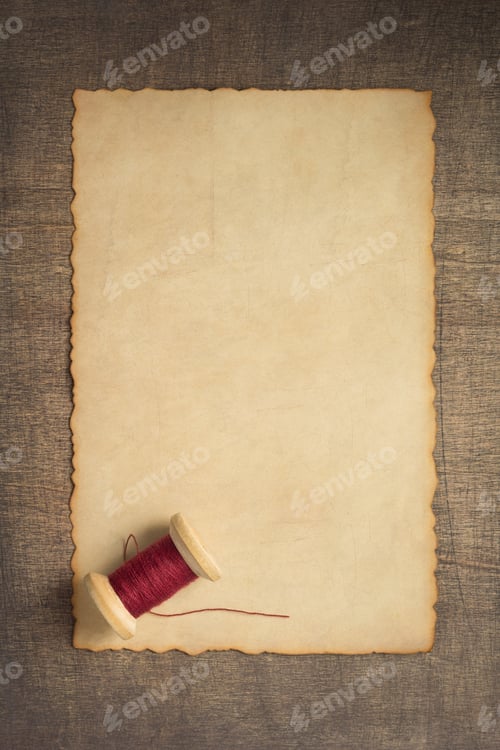 Preview: sewing thread on wooden table