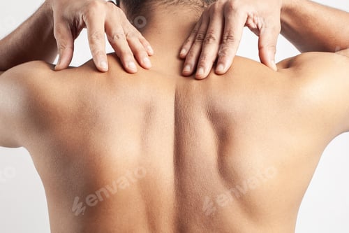 Preview: trapezius muscle pain, man suffering from pain on spinal cord or shoulder muscle