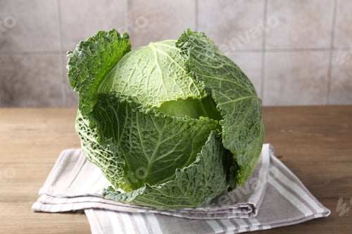 Preview: Fresh Savoy cabbage on wooden table, closeup