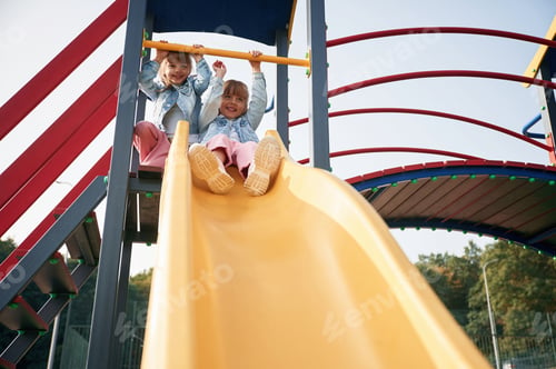 Preview: On the playground slide. Kids are having fun
