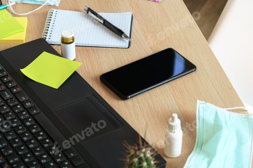 Preview: Medicine bottle on an office table with laptop