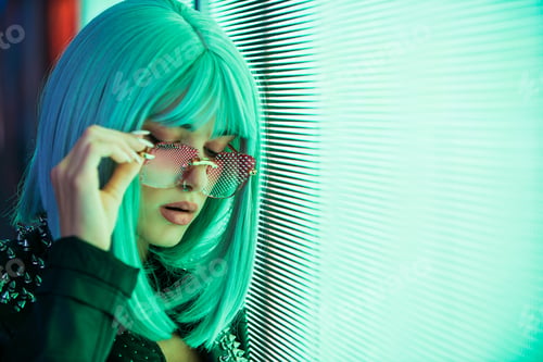 Preview: Beautiful woman illuminated by led lights