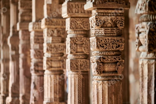 Preview: Stone columns with decorative bas relief of Qutb complex in South Delhi, India, close up pillars