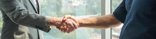 Preview: Long exposure of business handshake
