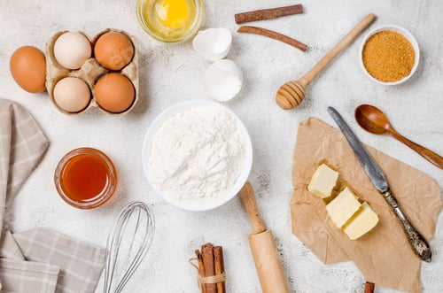 Preview: Ingredients for making dough dishes: cakes, cookies, muffins, pies on a gray background.