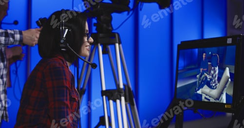 Preview: Woman in Studio Talks on Headset for Broadcast