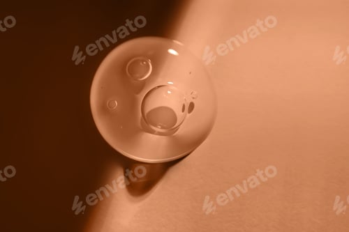 Preview: A drop of sunscreen body gel in the Peach Fuzz sunset light.