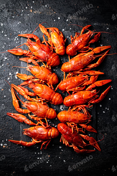 Preview: Boiled crayfish on a stone board with salt.