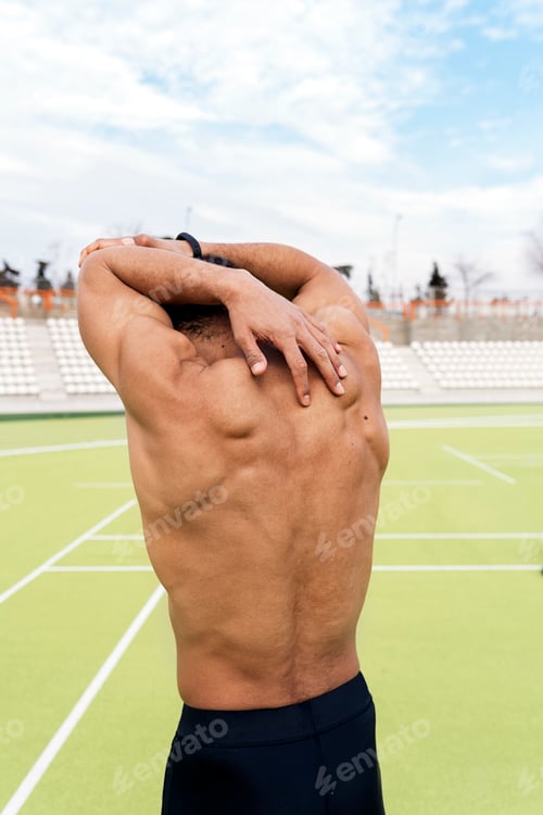 Preview: Black Athlete Stretching in Sports Track