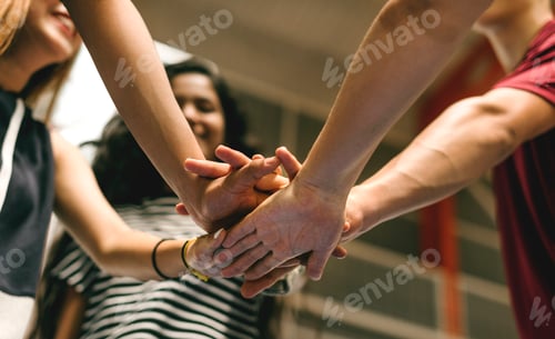 Preview: Group of teenager friends on a basketball court teamwork and togetherness concept