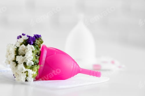 Preview: Menstrual cup and flower bud close up