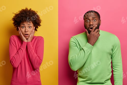 Preview: Photo of startled emotional ethnic woman and man terrified by shocking news, stare at camera, cannot