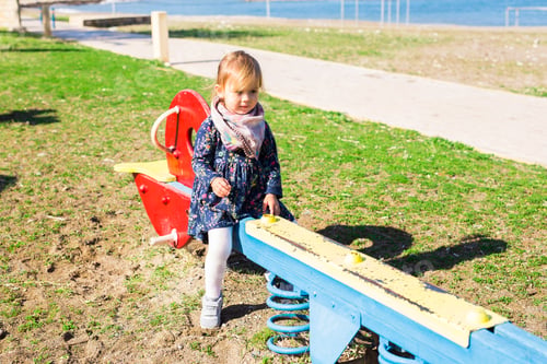 Preview: Active little girl on playground