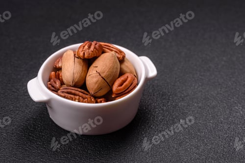 Preview: Delicious nutritious pecan nuts in ceramic bowl
