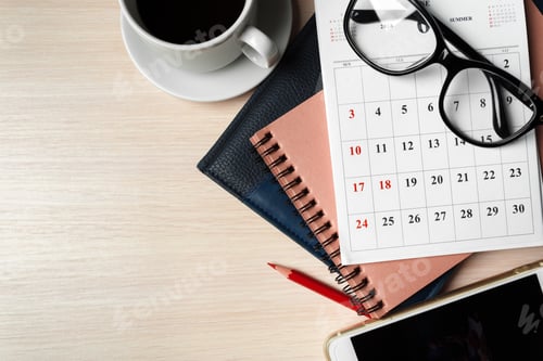 Preview: Organizing tasks with a calendar, notebooks, and coffee in a cozy workspace
